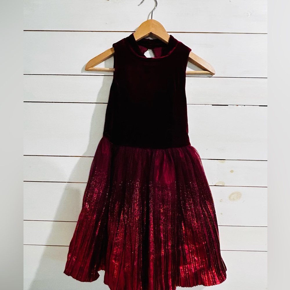 A Zunie dress, velvet on the top and a glitter ruffle on the bottom, maroon